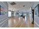 Spacious living area with hardwood floors, decorative molding, and ample natural light at 2510 Cross More St, Valrico, FL 33594