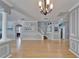 Spacious living area with hardwood floors and decorative molding at 2510 Cross More St, Valrico, FL 33594