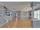 Open-concept living area with hardwood floors and views of the entryway and kitchen at 2510 Cross More St, Valrico, FL 33594