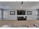 Large living room showcasing a media center, large windows and neutral carpeting at 2510 Cross More St, Valrico, FL 33594