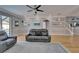 Inviting living room showcasing stylish gray walls, hardwood floors, comfortable seating and bright lighting at 2510 Cross More St, Valrico, FL 33594