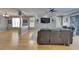 Spacious living room featuring wood floors, ample natural light, ceiling fan, and modern decor at 2510 Cross More St, Valrico, FL 33594