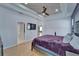 Relax in this main bedroom with tray ceiling, fan, and ample natural light at 2510 Cross More St, Valrico, FL 33594