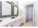 Beautiful bathroom with double vanity, decorative mirrors, modern sink, and tiled flooring at 2706 Bent Leaf Dr, Valrico, FL 33594