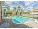 Inviting screened-in pool and spa with brick patio, perfect for outdoor relaxation and entertaining at 2706 Bent Leaf Dr, Valrico, FL 33594