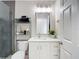 Modern bathroom featuring new vanity, framed mirror, neutral walls, and tiled shower at 2874 Bayshore Trails Dr, Tampa, FL 33611
