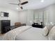 Comfortable bedroom with a ceiling fan, bay windows, and modern decor, perfect for relaxation and rest at 2874 Bayshore Trails Dr, Tampa, FL 33611