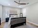 Charming bedroom with a ceiling fan, soft natural light, and stylish decor creates a peaceful and inviting atmosphere at 2874 Bayshore Trails Dr, Tampa, FL 33611