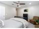 Inviting bedroom with a ceiling fan, TV, and comfortable seating offers a relaxing space for rest and entertainment at 2874 Bayshore Trails Dr, Tampa, FL 33611