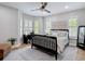 Bright bedroom with plantation shutters, a ceiling fan, neutral walls, and modern furnishings for a cozy retreat at 2874 Bayshore Trails Dr, Tampa, FL 33611