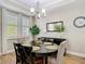 Dining room features natural light, an elegant chandelier, and a stylish buffet cabinet at 2874 Bayshore Trails Dr, Tampa, FL 33611