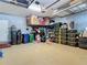 Spacious garage featuring overhead storage racks and well-organized storage bins and shelving at 2874 Bayshore Trails Dr, Tampa, FL 33611