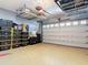 Well-organized garage featuring overhead storage racks and rows of storage bins at 2874 Bayshore Trails Dr, Tampa, FL 33611