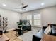 Bright home office featuring a ceiling fan, two monitors, and a comfortable sitting area at 2874 Bayshore Trails Dr, Tampa, FL 33611