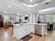 Open concept kitchen showcasing quartz countertops, stainless appliances and open living area at 2874 Bayshore Trails Dr, Tampa, FL 33611