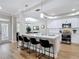 Modern kitchen featuring a quartz countertop island with bar seating and an open floor plan at 2874 Bayshore Trails Dr, Tampa, FL 33611