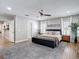 This relaxing main bedroom features a cozy area rug, ceiling fan, and plush decor at 2874 Bayshore Trails Dr, Tampa, FL 33611