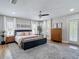 The main bedroom is brightly lit with windows dressed with plantation shutters and decoratively adorned at 2874 Bayshore Trails Dr, Tampa, FL 33611