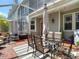 Covered patio with dining and lounge area, ideal for outdoor gatherings at 2874 Bayshore Trails Dr, Tampa, FL 33611