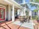 Covered outdoor patio with dining and grilling area, perfect for entertaining guests at 2874 Bayshore Trails Dr, Tampa, FL 33611