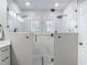 A frameless glass shower featuring dual shower heads and natural light at 2874 Bayshore Trails Dr, Tampa, FL 33611