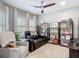 Cozy sitting area with book shelves, plantation shutters, and comfortable seating at 2874 Bayshore Trails Dr, Tampa, FL 33611