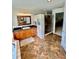 Bathroom featuring a shower, vanity with granite, framed mirror, and tile flooring at 3109 Tarpon Woods Blvd, Palm Harbor, FL 34685