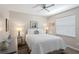 Bedroom with a ceiling fan, neutral paint, and a window for plenty of natural light at 3109 Tarpon Woods Blvd, Palm Harbor, FL 34685