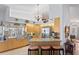 Open kitchen with stainless steel appliances, kitchen island and adjacent dining area at 3109 Tarpon Woods Blvd, Palm Harbor, FL 34685