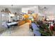Open concept kitchen with wooden cabinetry and stainless steel appliances overlooking dining area at 3109 Tarpon Woods Blvd, Palm Harbor, FL 34685