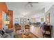 Spacious living room featuring hardwood floors, a decorative fireplace, and ample natural light at 3109 Tarpon Woods Blvd, Palm Harbor, FL 34685