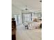 Light and airy main bedroom with access to an en suite, featuring a ceiling fan and soft natural light at 3109 Tarpon Woods Blvd, Palm Harbor, FL 34685