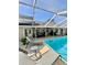 Relaxing poolside view showcasing an inviting pool, patio and serene outdoor space at 3109 Tarpon Woods Blvd, Palm Harbor, FL 34685