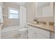 Cozy bathroom with tiled walls, vanity with granite counter and shower-tub combo at 330 47Th N Ave, St Petersburg, FL 33703