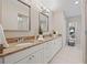 Bathroom featuring double sink vanity with granite countertop and large mirror at 330 47Th N Ave, St Petersburg, FL 33703