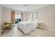 Inviting bedroom with a large window and a comfortable chair at 330 47Th N Ave, St Petersburg, FL 33703