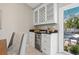 Charming dining area with granite countertop bar, beverage cooler, and view of the backyard pool at 330 47Th N Ave, St Petersburg, FL 33703