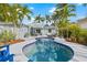 Backyard with a pristine pool, seating area and lush landscaping creating a private retreat at 330 47Th N Ave, St Petersburg, FL 33703