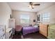 Bedroom with window and ceiling fan offering comfort and function at 4125 89Th E St, Palmetto, FL 34221
