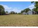 Two-story blue home with a spacious yard, shed, and ample space for outdoor activities at 4125 89Th E St, Palmetto, FL 34221