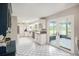 Well-lit kitchen with white cabinetry, granite countertops, stainless steel appliances, and tile flooring at 4125 89Th E St, Palmetto, FL 34221