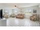 Comfortable living room with tile floors, natural light, and comfortable furniture, perfect for relaxation at 4125 89Th E St, Palmetto, FL 34221