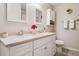 Bathroom with double sinks, a white vanity, and a separate toilet area at 4417 W Fair Oaks Ave, Tampa, FL 33611