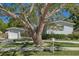 A single-Gathering home with a well-manicured lawn and mature trees at 4417 W Fair Oaks Ave, Tampa, FL 33611