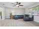 Cozy living room with plush seating, stylish decor, and plenty of natural light at 4417 W Fair Oaks Ave, Tampa, FL 33611
