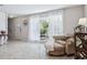 Bright living room with large window, tiled floor, and neutral colors at 4417 W Fair Oaks Ave, Tampa, FL 33611