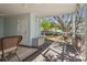 Enclosed porch showing outdoor access and providing a seamless transition to the backyard at 4417 W Fair Oaks Ave, Tampa, FL 33611