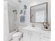 Bright bathroom featuring a shower-tub combo, elegant vanity, and stylish fixtures at 4750 Dolphin Cay S Ln # 209, St Petersburg, FL 33711