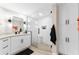 Modern bathroom with a glass-enclosed shower, granite countertops, and ample cabinet space at 4750 Dolphin Cay S Ln # 209, St Petersburg, FL 33711