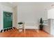 Charming entryway with a green door adorned with a wreath and a cozy bench for seating at 4750 Dolphin Cay S Ln # 209, St Petersburg, FL 33711